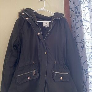 Army green coat from Greenlander collection.